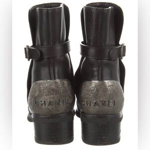 Chanel black leather moto boots with silver Chanel sign